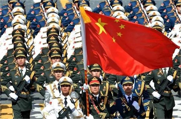 chinese militia members march during a military parade in beijing