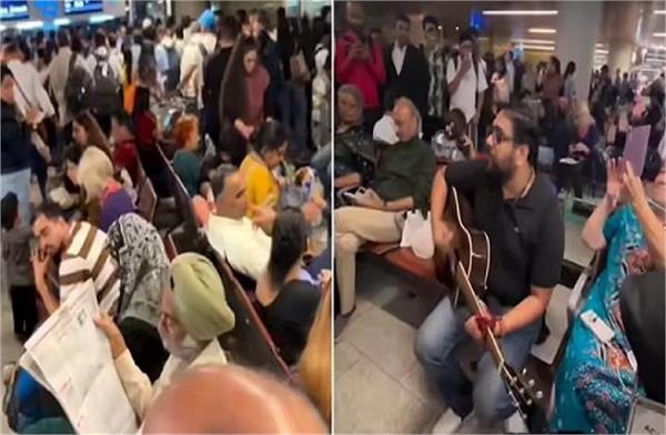 young man creates wonderful atmosphere by playing guitar