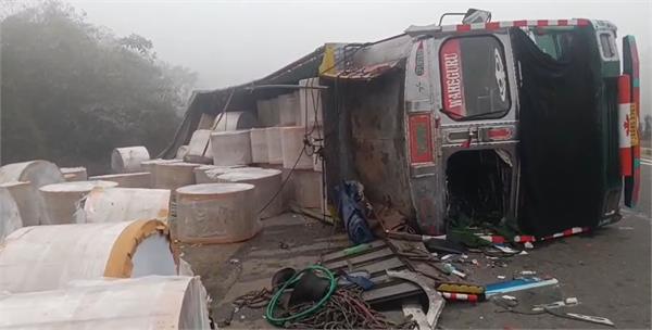 truck overturns after jumping divider while trying to save car