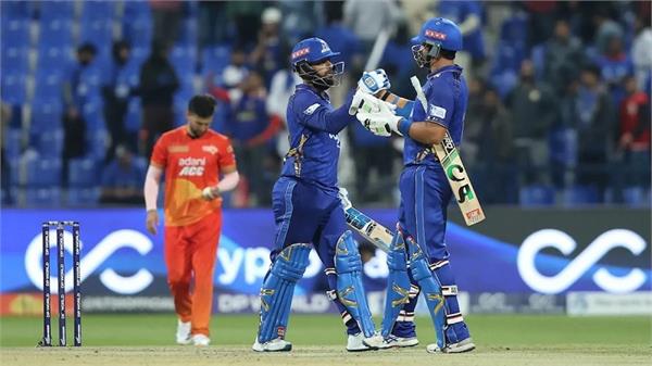 pooran and wasim lead mi emirates to the playoffs