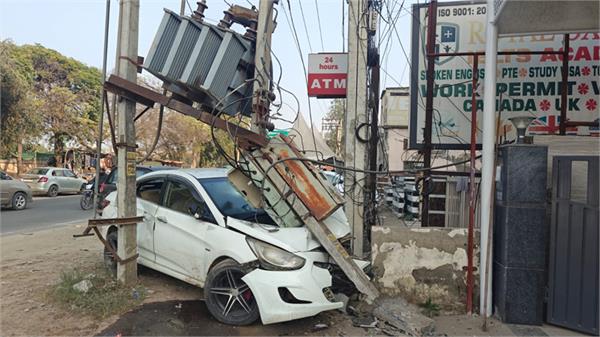 out of control car hits transformer pole