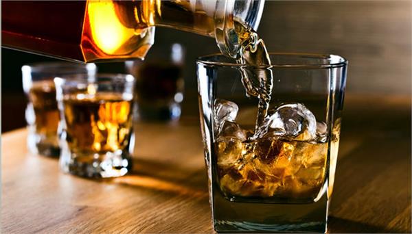 why are drops sprinkled on ground 3 times before drinking alcohol