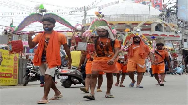 this year flowers showered and sticks fired at kanwar yatris