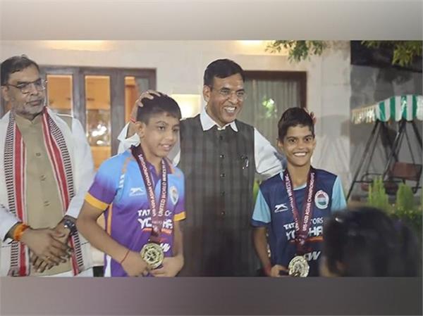 mandaviya felicitates asian wrestling championship medalists