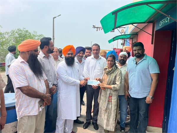 mla jasvir raja gill handed over one month  s salary cheque to dc ashika jain