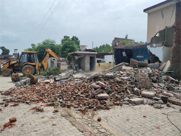 bulldozer action taken on drug smugglers   houses