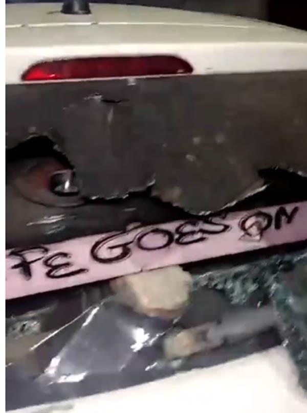 a dozen youths attack a vehicle  victim flees to save his life