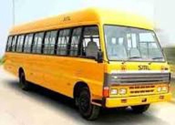 school buses are being driven without lights in dense fog