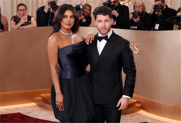 priyanka chopra gets   mischievous   on the red carpet with husband nick jonas