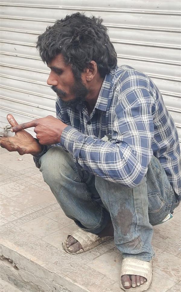 mentally disturbed person harasses passersby and shopkeepers