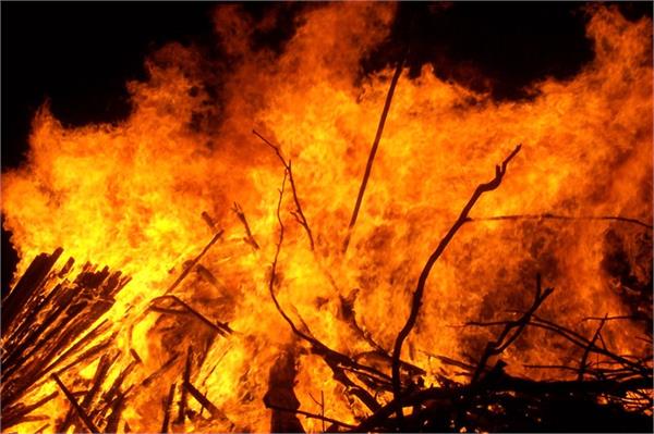 tamil nadu  elderly farmer set on fire  four arrested