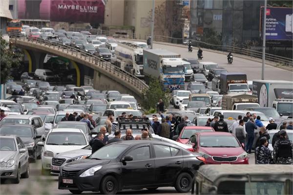 protesters block beirut roads cabinet approves new taxes