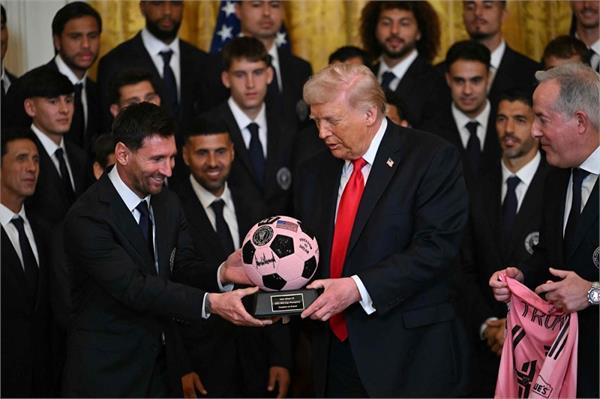 lionel messi gifts donald trump a pink football studded with gems