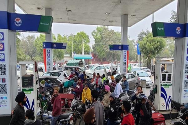 long lines of vehicles at petrol pumps