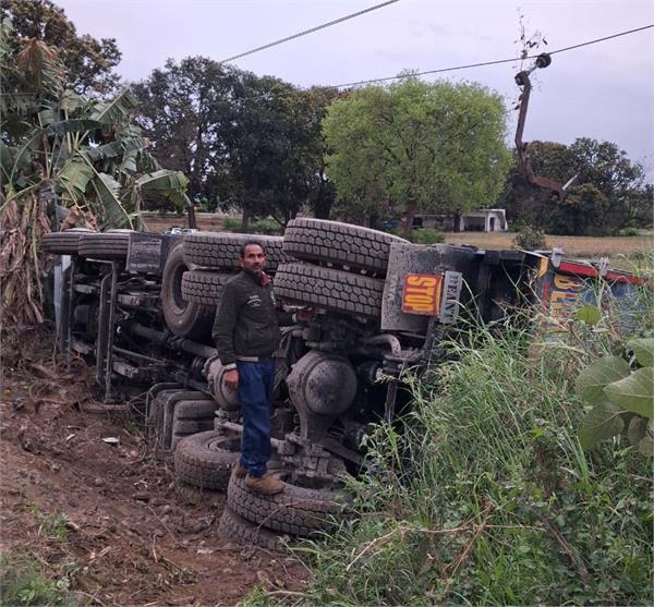tipper loaded with gravel overturned