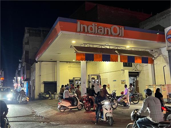 diesel and petrol run out at the petrol pump  a large crowd gathers 