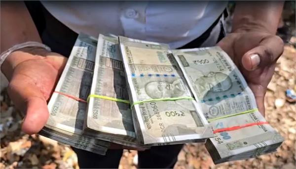 2 lakh dumped in canal along with worship materials