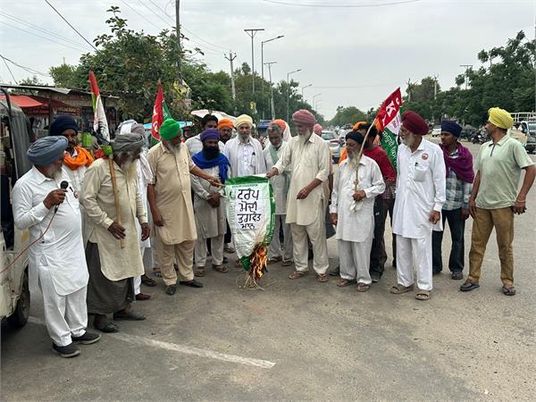 democratic farmers   assembly burns effigies of trump  modi and mann