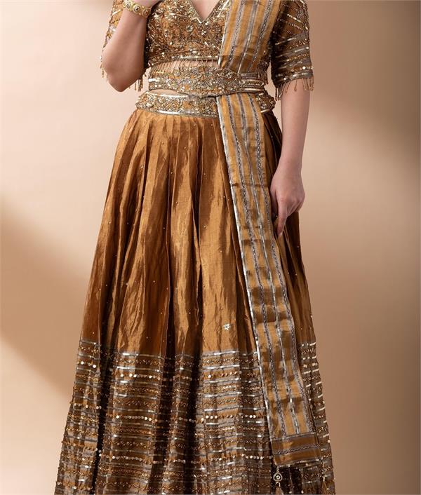 young women  golden work lehenga choli  craze