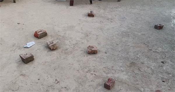 youth throws bricks at neighbors over old grudge