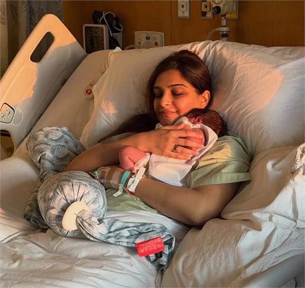 sonam kapoor cradles baby boy in adorable first post after birth