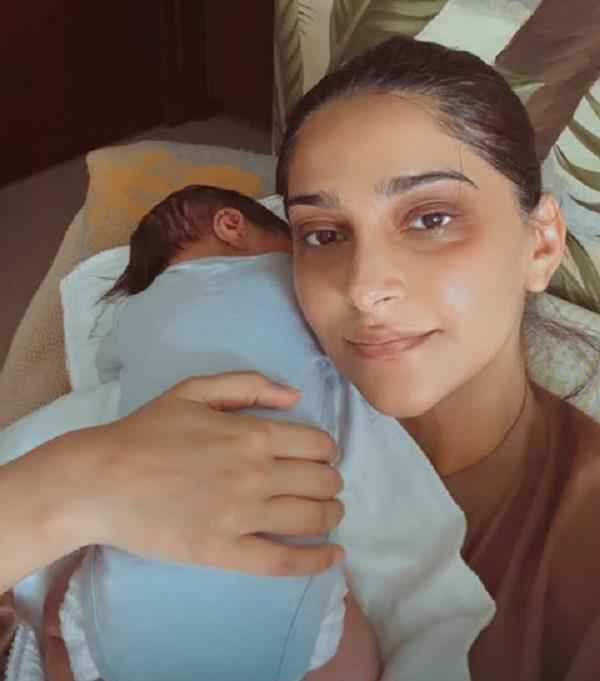 sonam kapoor flaunts her dark circles as she lovingly holds her newborn son