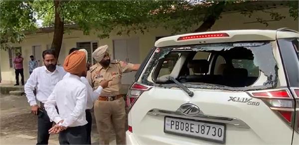broken glass from a car parked outside the house