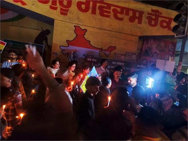 people hold candle march after youth  s death
