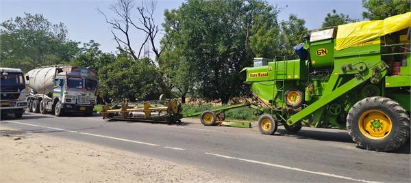 a terrible collision between a combine and a truck