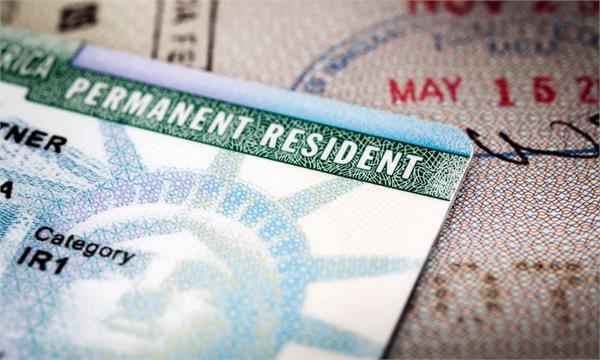 us revokes green cards iran officials immigration