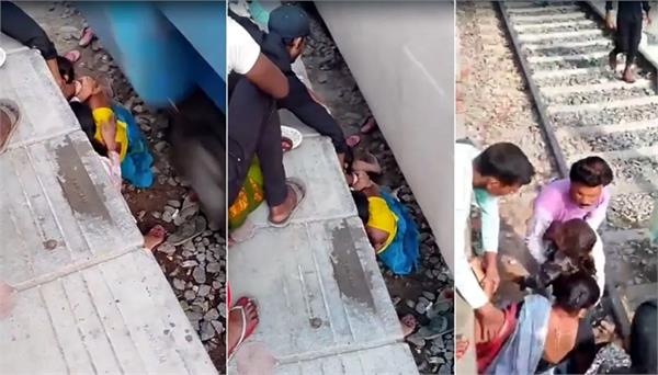 women trapped under a moving train