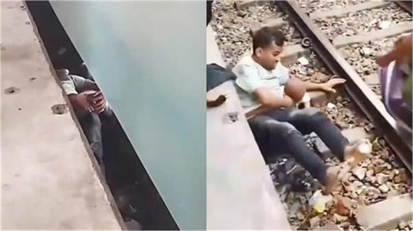 innocents fall under a moving train