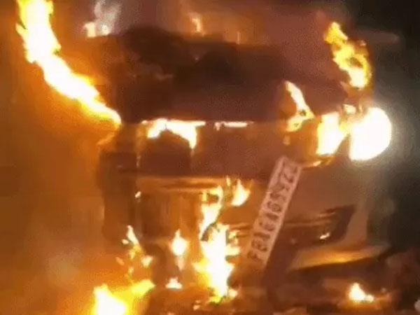 a car parked on gt road national highway caught fire