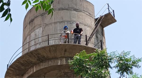 sarpanch climbs on water tank for panchayat rights in village kalalmajra