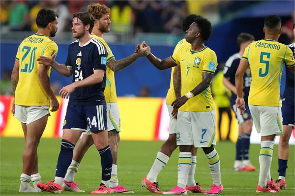vinicius two goals help brazil top group c