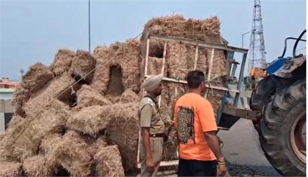 two trolleys loaded with straw overturned on the highway in phagwara