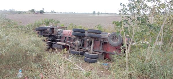 trucks overturned  driver injured