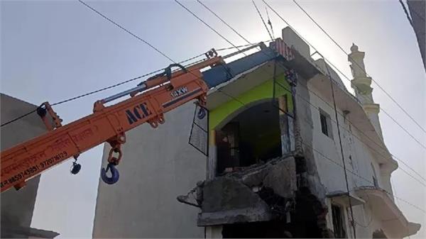 bulldozer runs on mosque built