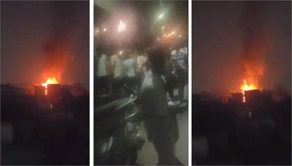 flames rise from the third floor of a 4 storey building