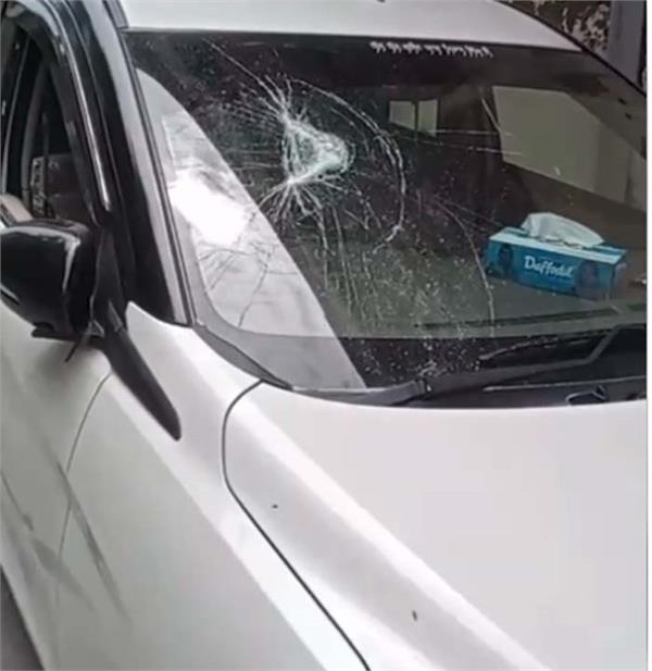 mischievous boys smashed the windows of several cars parked in the street