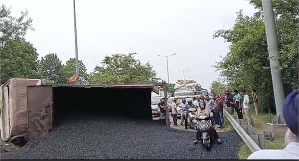 tipper loaded with gravel overturns on chugitti flyover