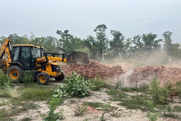bulldozers run over unauthorized colonies