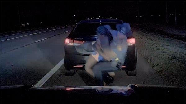 police officer punches woman