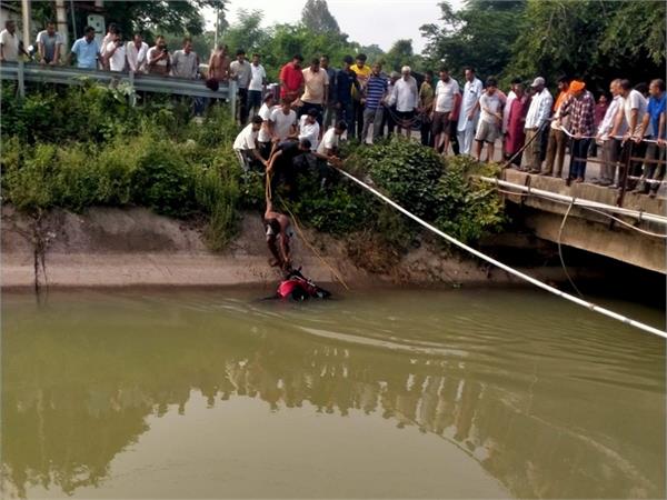 man falls into canal with motorcycle
