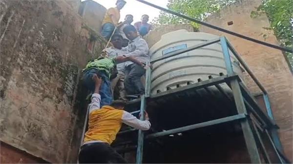 student upset over school expulsion climbs ajmeri gate in jaipur