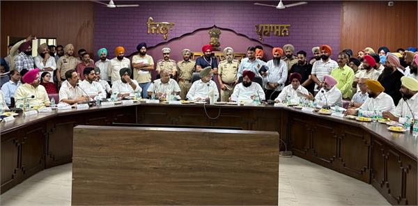 sukhjinder randhawa reviews the progress of development works at a meeting